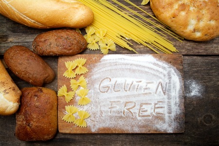 gluten free  word with bread on wood backgroundの写真素材
