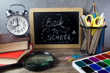Back to school supplies. Books and blackboard.の写真素材