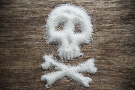 unhealthy white sugar on wooden background conceptの写真素材