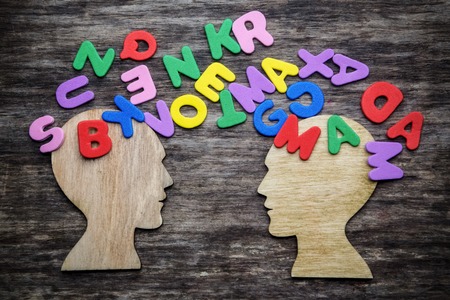 Heads silhouette with letters on wooden backgroundの写真素材
