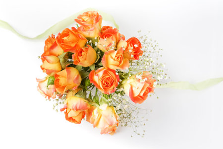 beautiful bouquet of orange roses on white backgroundの写真素材