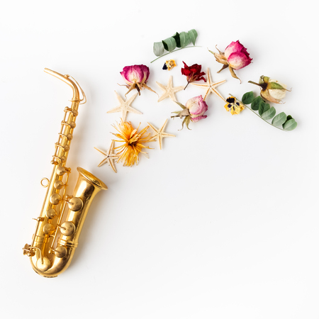 Jazz Day. Saxophone with flowers. Flat layの写真素材