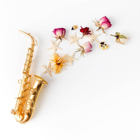 Jazz Day. Saxophone with flowers. Flat layの写真素材
