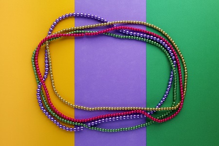 Mardi Gras beads background with place for text. Top viewの写真素材