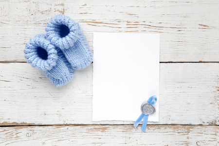 Greeting children form with blue booties. Top viewの写真素材