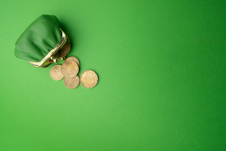 green purse coin EURO on green background. Top viewの写真素材