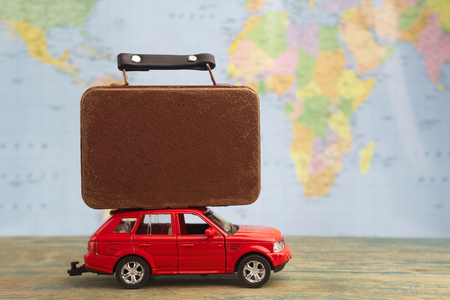 Retro car with suitcases on map. Summer vacation conceptの写真素材