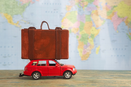 Retro car with suitcases on map. Summer vacation conceptの写真素材