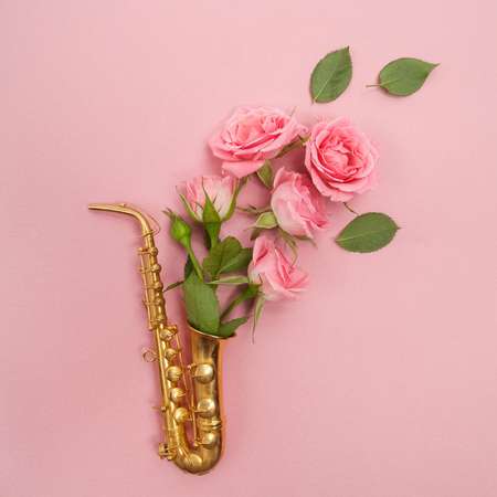 Jazz Day. Saxophone with flowers. Flat layの写真素材