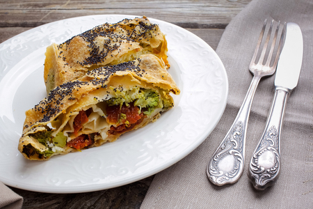 Strudel with cheese and sun-dried tomatoes. Homemade pie, strudel and snacksの写真素材