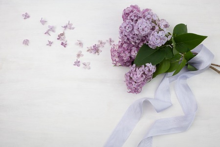 The beautiful lilac on a bright wooden backgroundの写真素材