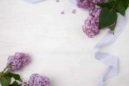 The beautiful lilac on a bright wooden backgroundの写真素材