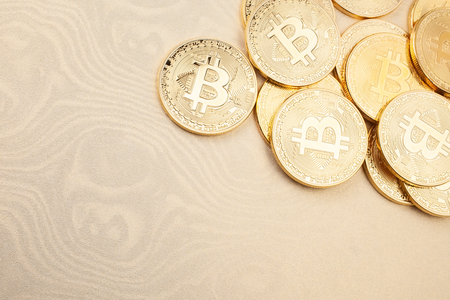 Bitcoins on gold backgroundの写真素材