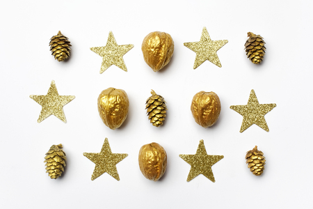 Christmas composition. christmas golden decorations on light background. Top view, flat layの写真素材