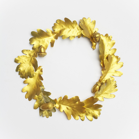 Golden oak leaf frame,on light grey background. Flat layの写真素材