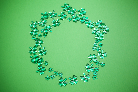 St Patricks Day background. Lucky spring with shamrock. Green clover wave border on green background.の写真素材
