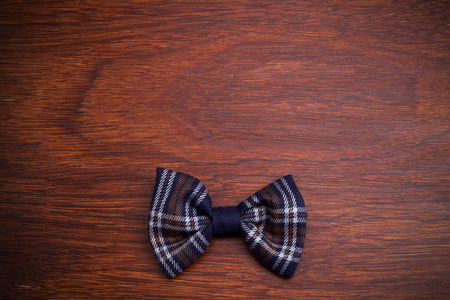 bow tie on dark wooden background. Top viewの写真素材