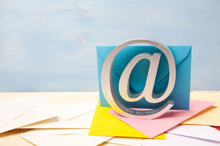 e-mail symbol on wooden background with copy spaceの写真素材