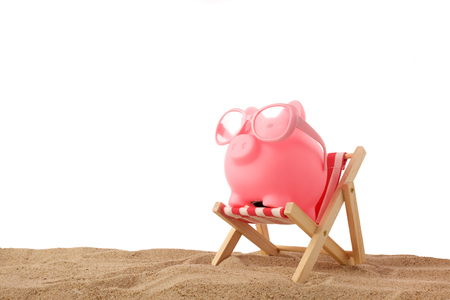 Piggy bank wearing retro sunglasses isolated on white backgroundの写真素材