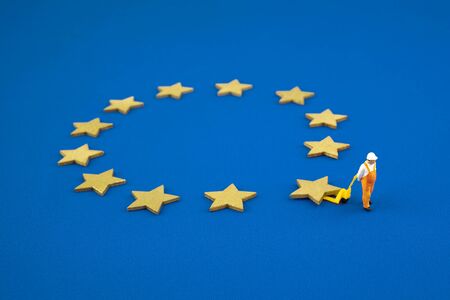 Brexit concept. The figure pushes one star out of the Europen Union Flagの写真素材