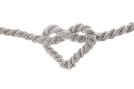 heart shape knot of rope isolated on white backgroundの写真素材