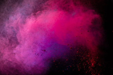 Freeze motion of colored dust explosion isolated on black background.