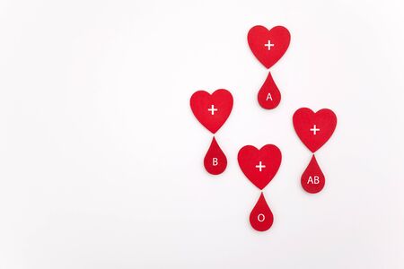 Blood drops with different blood types on white background. Top viewの写真素材