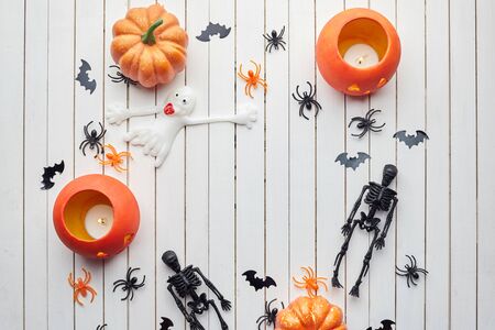 Halloween decorations on white wooden background. Halloween concept. Flat lay, top view, copy spaceの写真素材