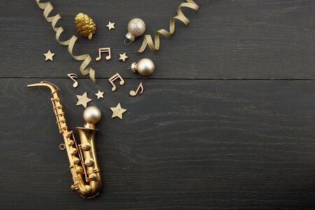 Happy New Year banner with gold saxophone as a party and celebration symbol. Top viewの写真素材