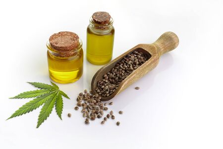 Hemp oil n a glass jar isolated on a white backgroundの写真素材