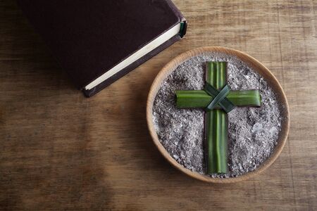 Ash wednesday, crucifix made of ash, dust as christian religion. Lent beginningの写真素材