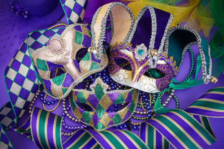 Festive mardi gras, venetian or carnivale mask on a purple background. Top viewの写真素材