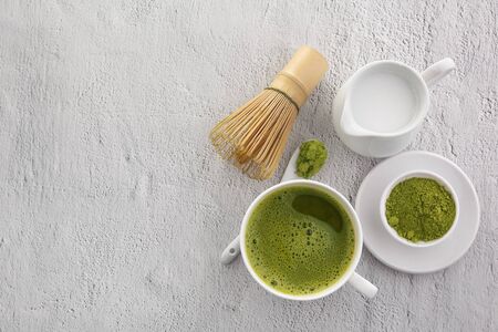 Matcha powder. Organic green matcha tea ceremony. Traditional japanese drink on white backgroundの写真素材