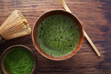 Set with green matcha tea on wooden background. Japanese tea ceremony. Food menu background. Asian, japanese, chinese background. Tea ceremony set.の写真素材