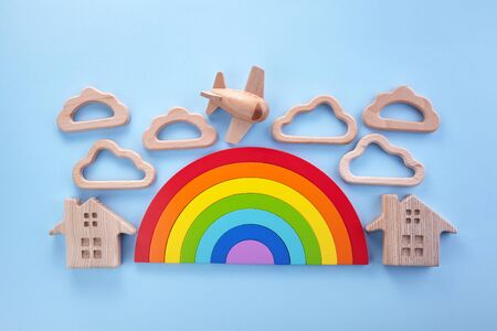 Colorful wooden toys background with rainbow. Preschool, childhood. Zero waste concept.の写真素材