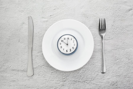Intermittent fasting. Minimal concept. Ketogenic diet concept. Fast time.