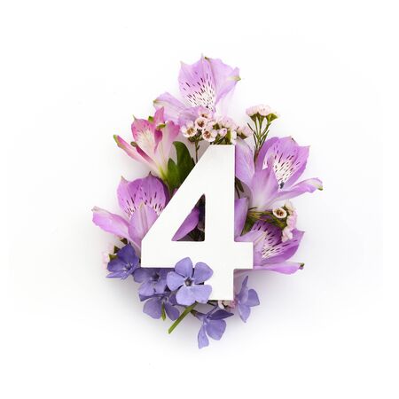 Creative layout with colourful flowers and number for. Flat lay. Top view.の写真素材