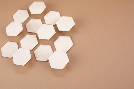 Honeycomb of different high on brown background