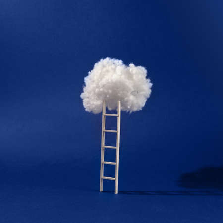 Step ladder leading to cloud. Minimal compositionの写真素材