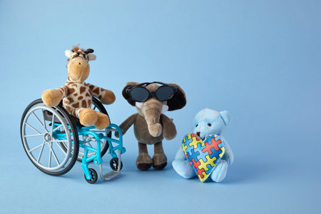 International day of persons with disabilities. Wheelchair with toys sign of different disabilities...