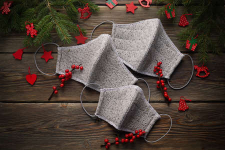 Christmas decration and face mask on wooden background.の写真素材