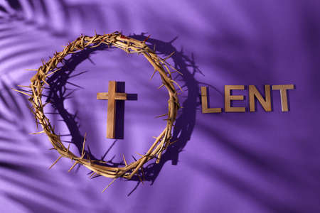 Lent season, Holy week and Good friday concept. Crown of torns and cross on purple backgroundの写真素材