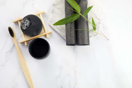 Activated Bamboo charcoal tooth powder on marble background.の写真素材