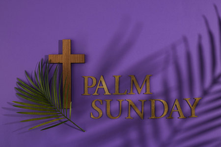 Palm sunday background. Cross and palm on purple background.