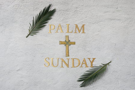 Palm sunday background. Cross and palm on grey background.の写真素材