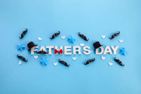 Fathers Day banner with mustache and hats on blue backgroundの写真素材