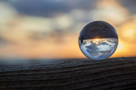 Magic sphere. Fortune teller, mind power concept. Crystal Ball reflecting water and sky.