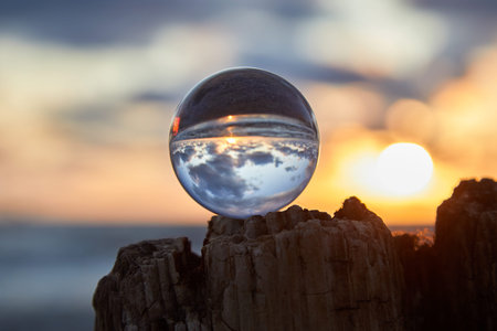Magic sphere. Fortune teller, mind power concept. Crystal Ball reflecting water and sky.