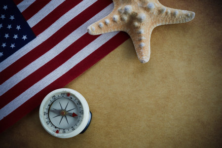Happy Columbus Day concept. Compass with American flag on vintage backgroundの写真素材