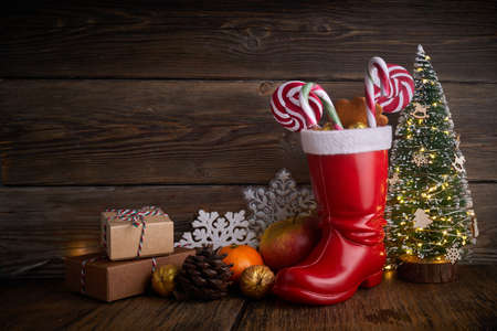 Santa boots with sweets and gifts for St. Nicholas Day on December 6th.の写真素材